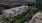 Aerial view of The Park at SouthSide apartment complex, featuring a modern facade and a view of the water.